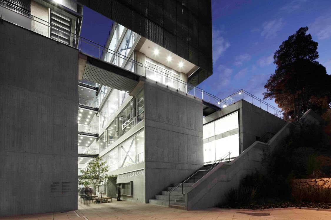 Los Andes University Sports Center - Illuminated concrete and glass exterior highlighting architectural form at night - Felipe Gonzalez Pacheco(0).jpg
